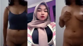Fitria Dewi, Jilbab Ketat Menggoda Dengan Payudara Besar Yang Menggairahkan